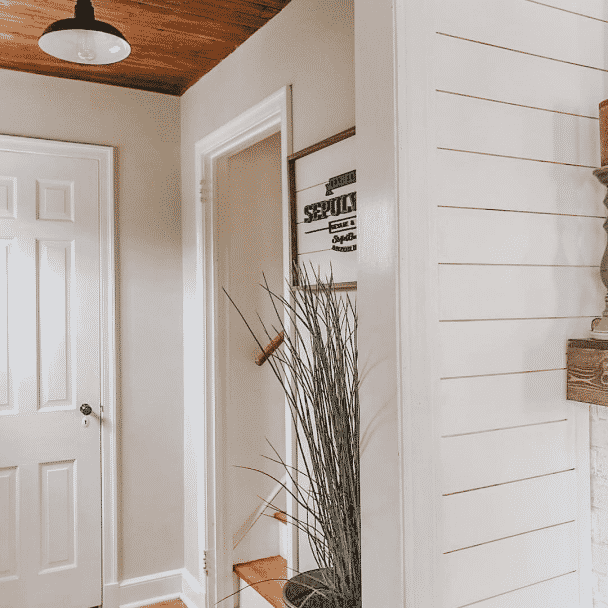 A home hallway painted in popular gray sw 6071 by @seslie_way.
