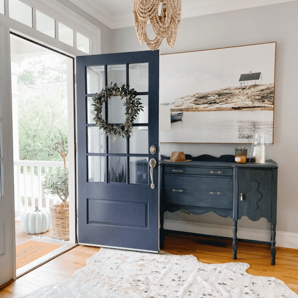 A foyer of a home painted in passive sw 7064 by @houseofbluehues.