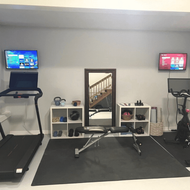 A basement home gym painted in reflection sw 7661 by @journeylovesdesign.