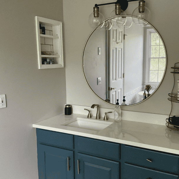 A bathroom painted in repose gray sw 7015 by @ravensinteriordesignllc.