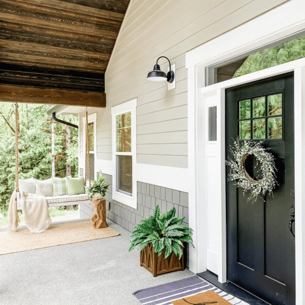 The exterior of a home painted in mindful gray sw 7016 by @lifeamongthecedars.