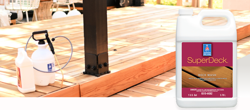 A stained wood deck with a sprayer to apply Sherwin-Williams SuperDeck deck wash
