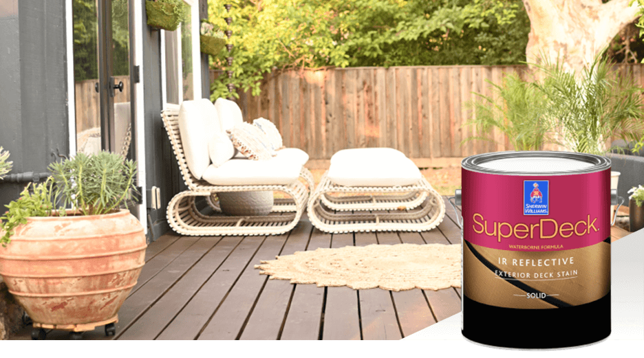 A backyard deck with white patio furniture and a potted plant. Sherwin-Williams SuperDeck.