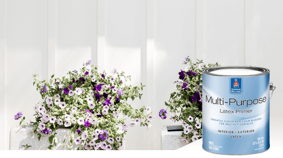 A white wall with purple and white flowers next to it. Multi-Purpose Latex Primer.