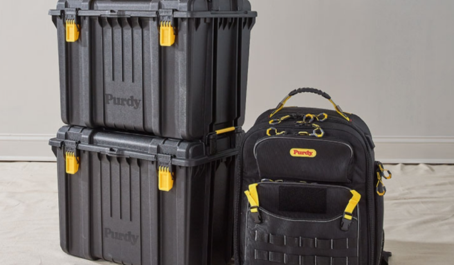 Two black storage boxes and a backpack from Purdy.