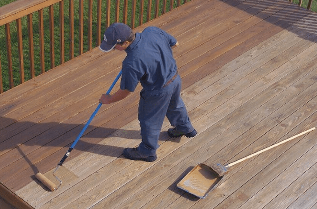 Person Staining a Deck.