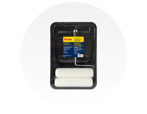 A Purdy paint roller inside a black paint tray.