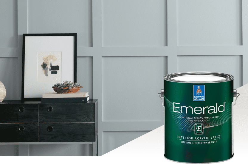 Grey wall with a table and art showcasing the SW Emerald interior paint.