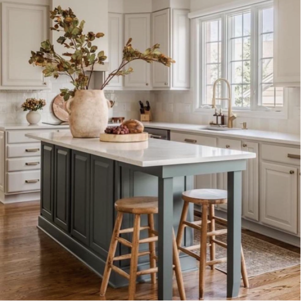 Bright white kitchen cabinets with windows, decor, island with bar stools, by @macfarland_painting.