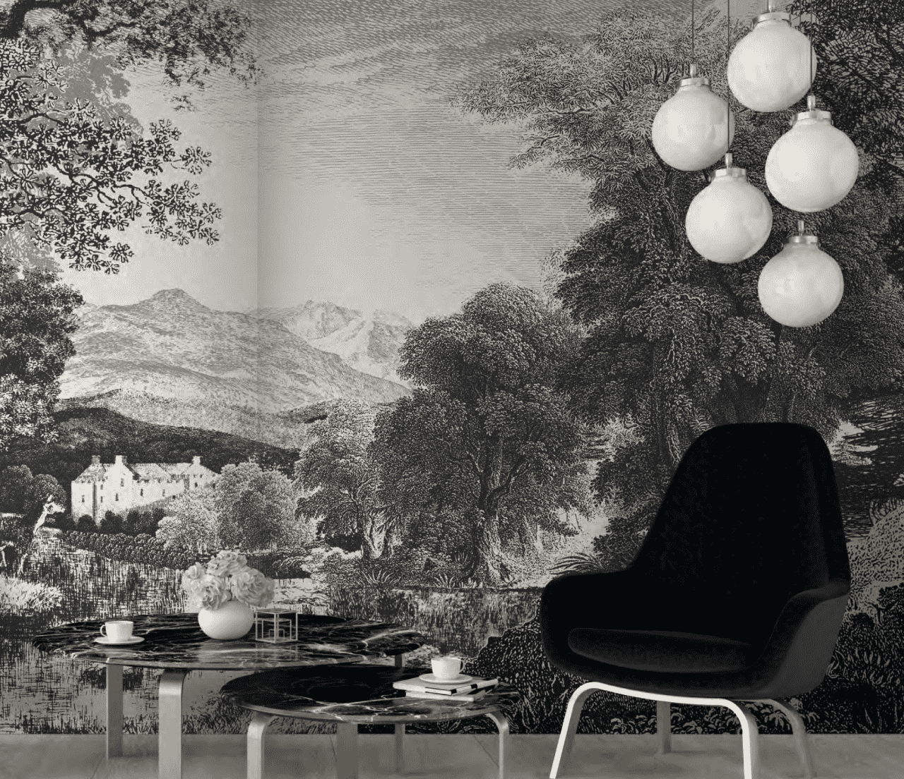 Black and white wallpaper with a nature scene of mountains and trees, some furniture in front of the wall.