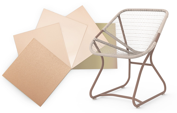 A wicker chair next to some neutral color tiles. 