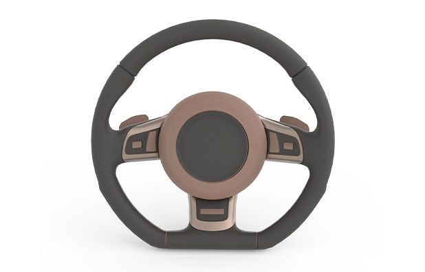 A steering wheel with a dark center and handles with some Redend Point SW 9081 (195-C4) in the middle.