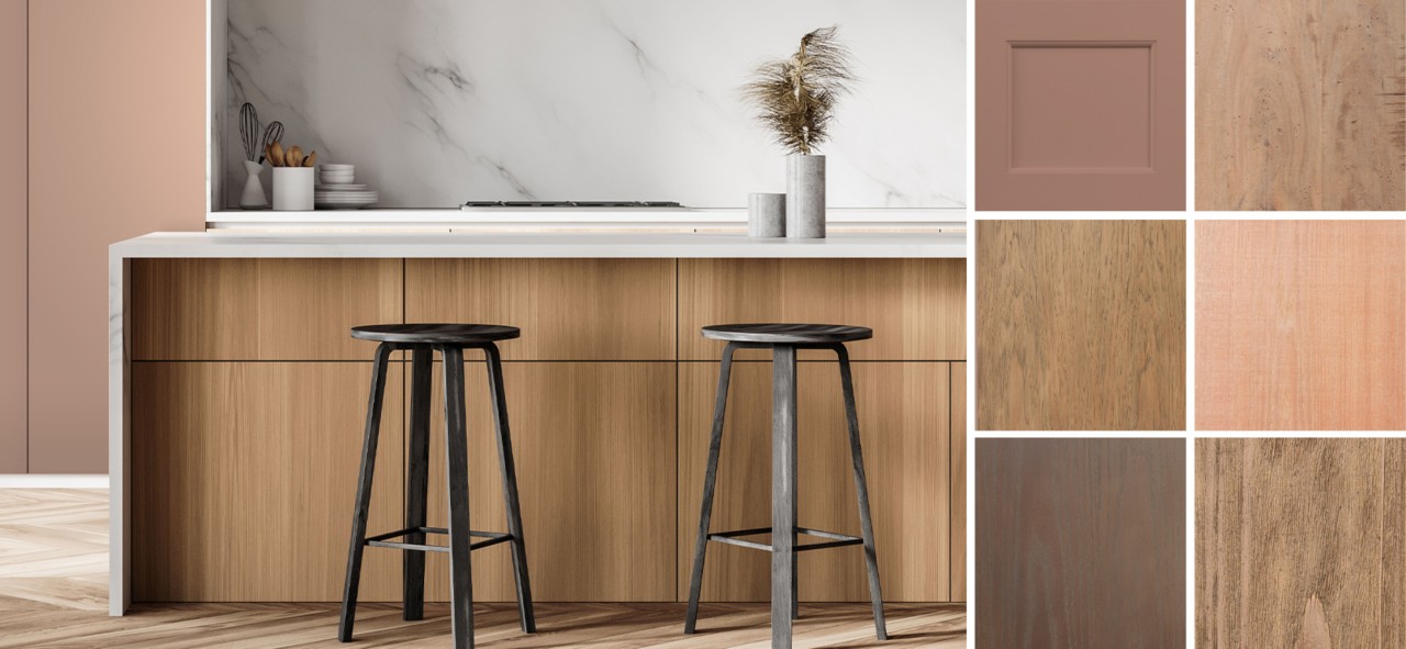 A bar top with black barstools against a white marble wall. Some neutral colored wood panels.