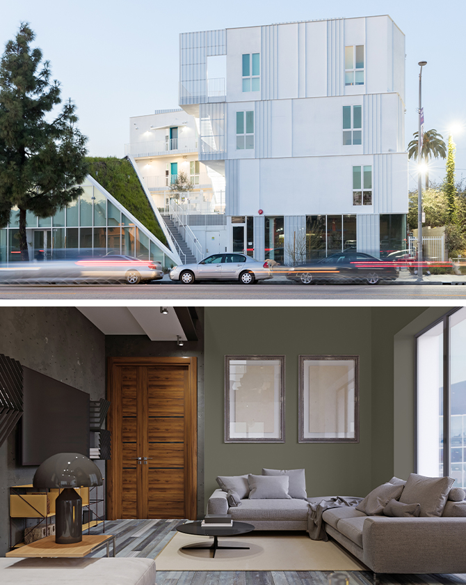 First image: Exterior of white modern four-story apartment building with wedge of green space extending down from the roof to street level. Second image: Urban apartment living area with gray sectional and coffee table in foreground, gray flooring, and artwork on green walls.