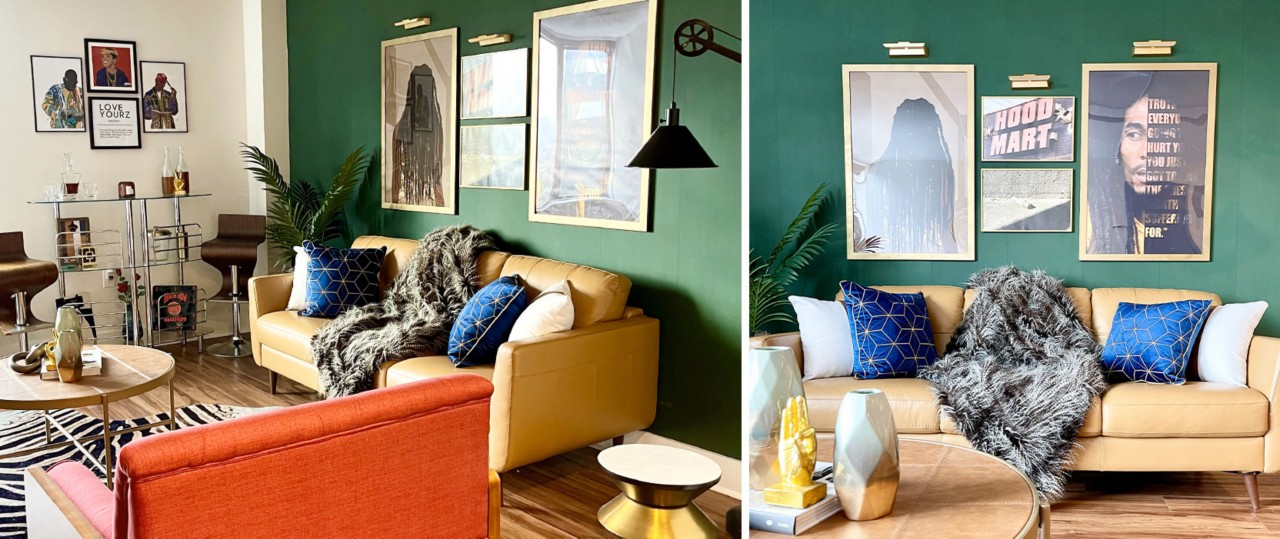 Eclectic living room with dark green accent wall and framed photo art with natural leather sofa, red-orange chair, faux zebra rug and a mix of accent tables.