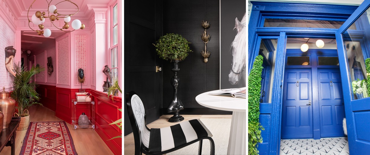 Left image: Interior hallway with pink walls and red wainscoting, crown molding, woven runner and eclectic globe chandelier. Center image: Corner of black painted room with greenery, large art print of black and white horse photo, with white table and black and white striped chair in foreground. Right image: Bold blue painted wood entry doors with transom, tile flooring, and ornamental greenery on either side.