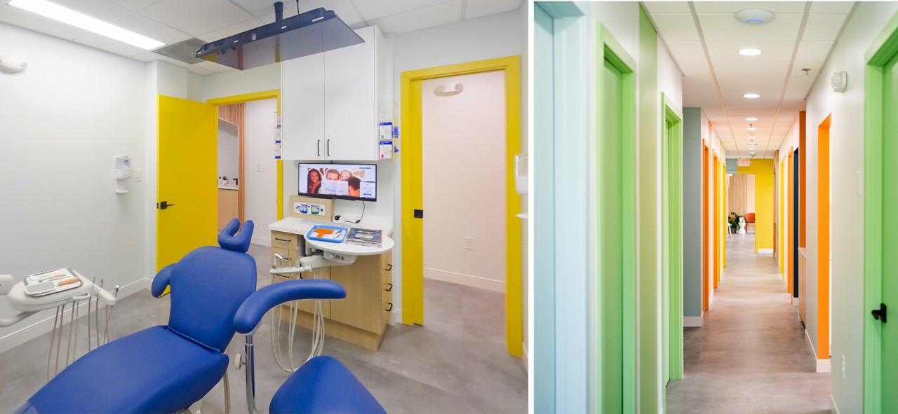Interior of dental exam room and corridor with white walls and cheerfully bright multicolored doors and trim.