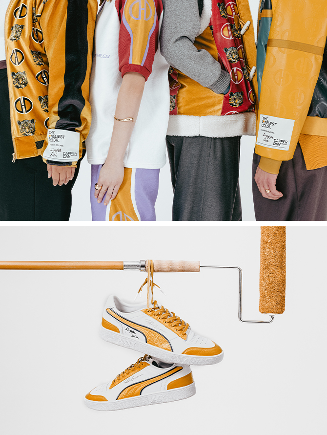 Studio photo of four models, shown from shoulder to knee, all wearing pieces of wearable art from Dapper Dan’s custom The Loneliest Color collection. Custom-designed white sneakers with Kingdom Gold details hanging by the shoelaces from a horizontal paint roller.