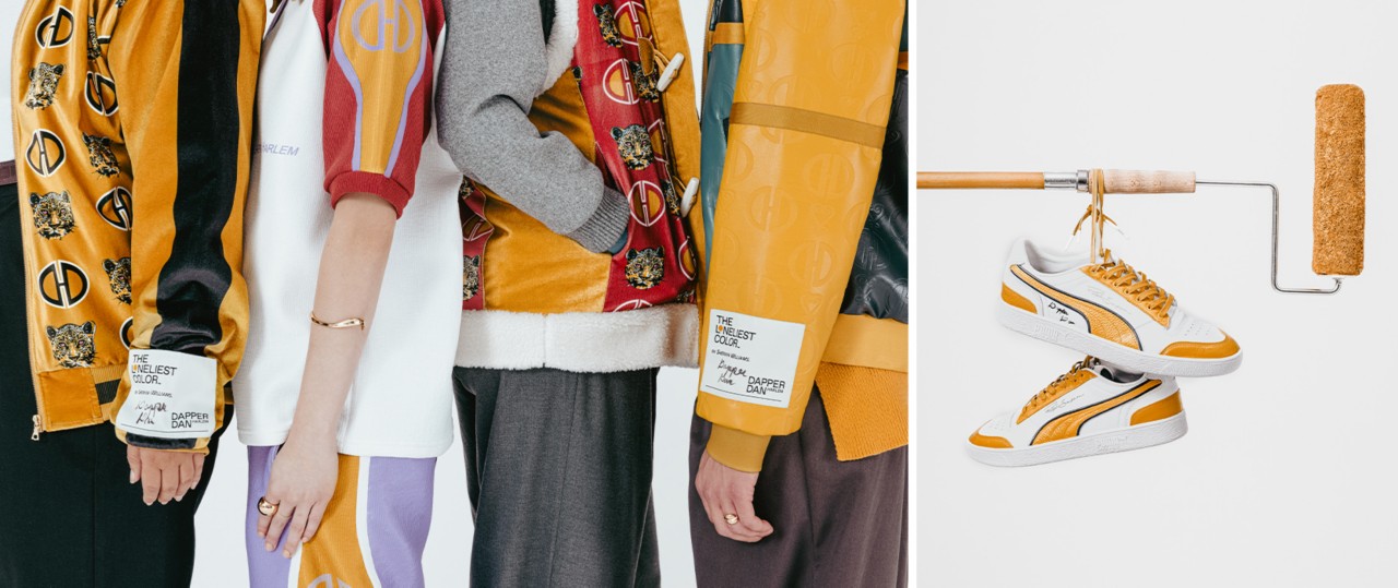 Studio photo of four models, shown from shoulder to knee, all wearing pieces of wearable art from Dapper Dan’s custom The Loneliest Color collection. Custom-designed white sneakers with Kingdom Gold details hanging by the shoelaces from a horizontal paint roller.