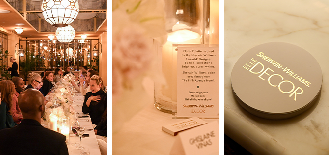 Long table with white place settings and candle centerpieces in a cozy and warmly lit room.