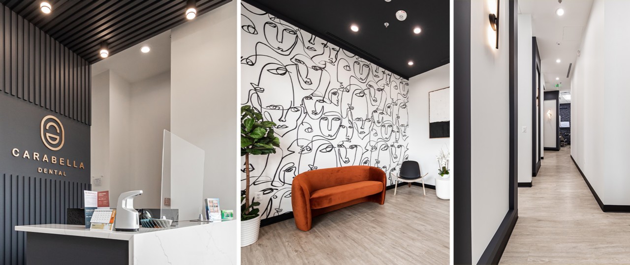 Sleek, modern design of dental facility interior featuring black and white color scheme, waiting area with accent wall of line-drawn face pattern and rust orange sofa, white walls and black trim in high-ceilinged corridors.