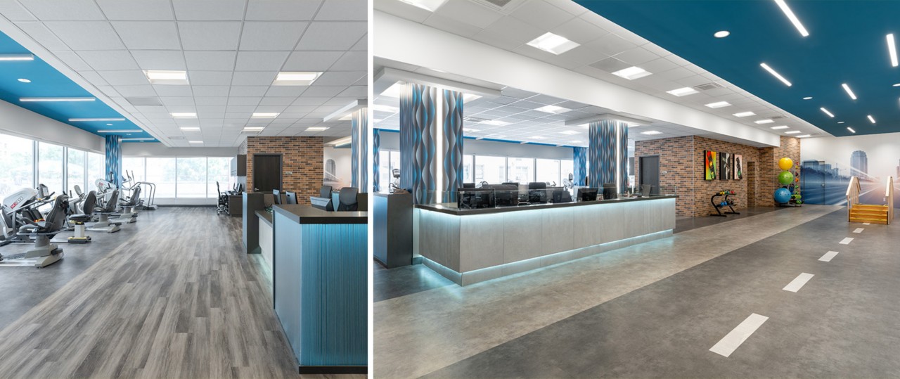 Physical therapy fitness center with blue painted accents, therapy equipment, and architecturally lit front desk.