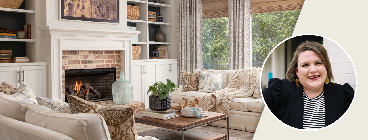 Inviting living room with brick hearth, built-ins, and comfortable sofas topped with throw blankets and pillows.