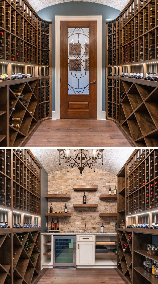 Large wine cellar with arched ceiling, exposed brick, warm woods and a chandelier.