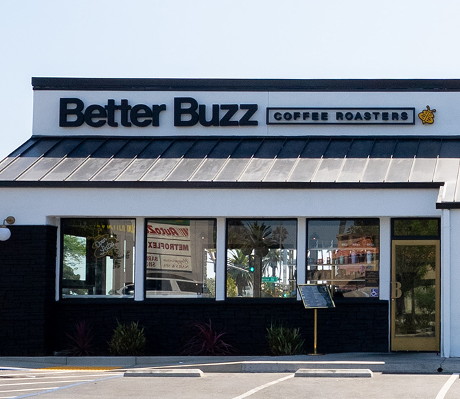 Exterior of the Better Buzz Coffee Roasters Oceanside location with signage and hexagonal designs.