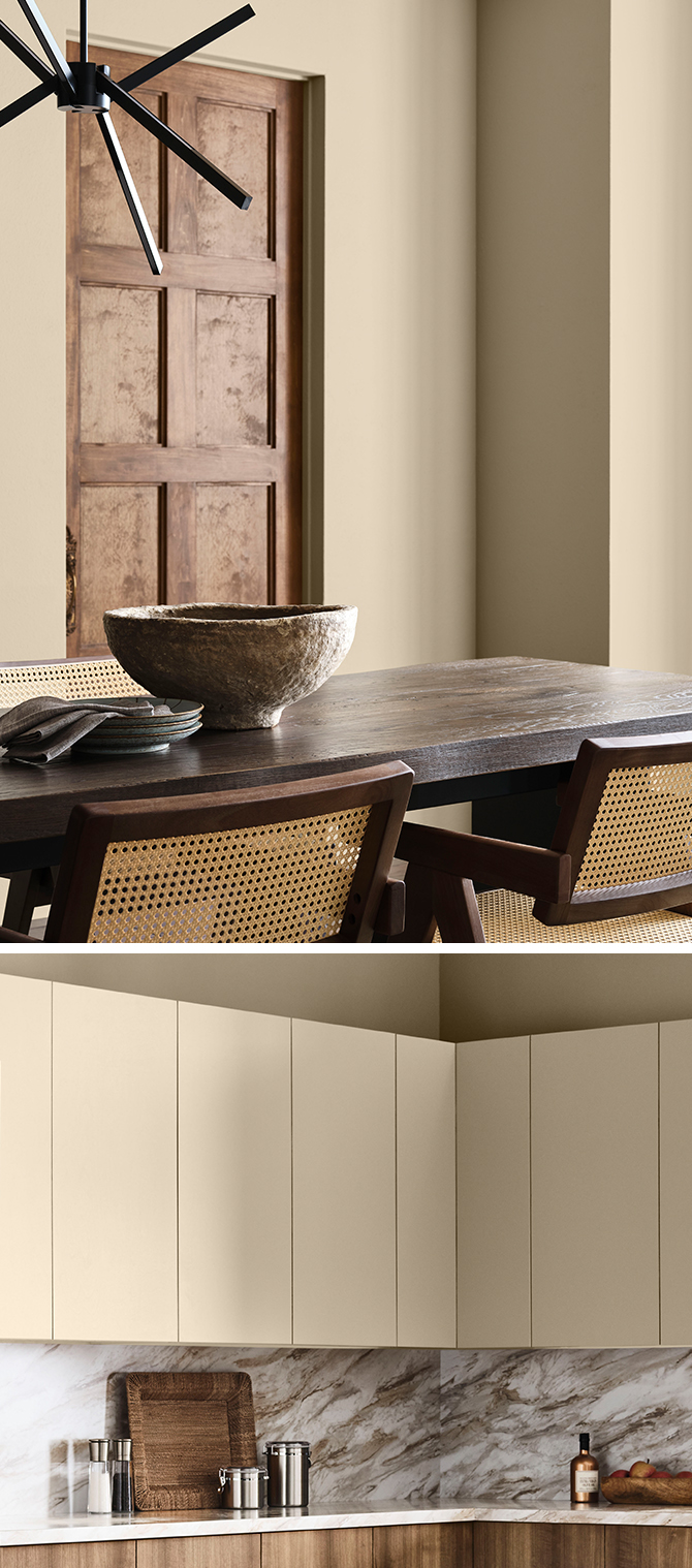 Industrial style dining room with Universal Khaki walls and kitchen area with wooden lower cabinets, marble counters and backsplash, and Universal Khaki uppers.