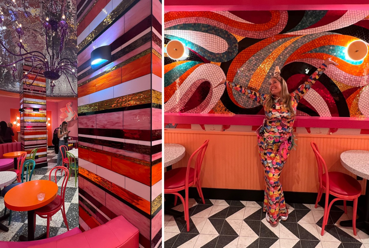 Interior of Serendipity 3 Times Square, with bold and colorful tiled walls, black and white chevron patterned tile floors, multicolor tables and chairs, and Allison Eden posed in front of her abstract mosaic installation.