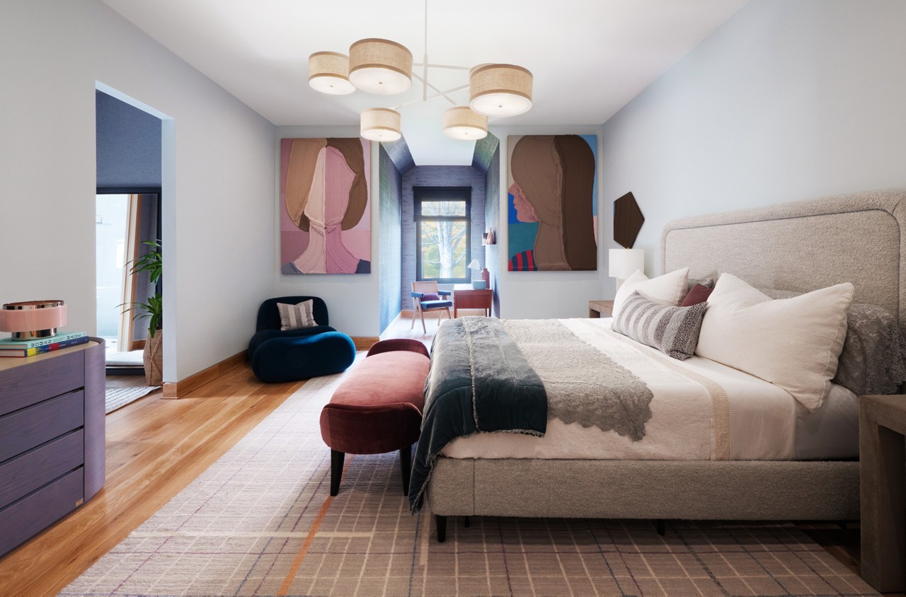 A modern bedroom with a large bed, abstract art of faces by Jose Lerma flanking a window, and a mix of contemporary furniture.
