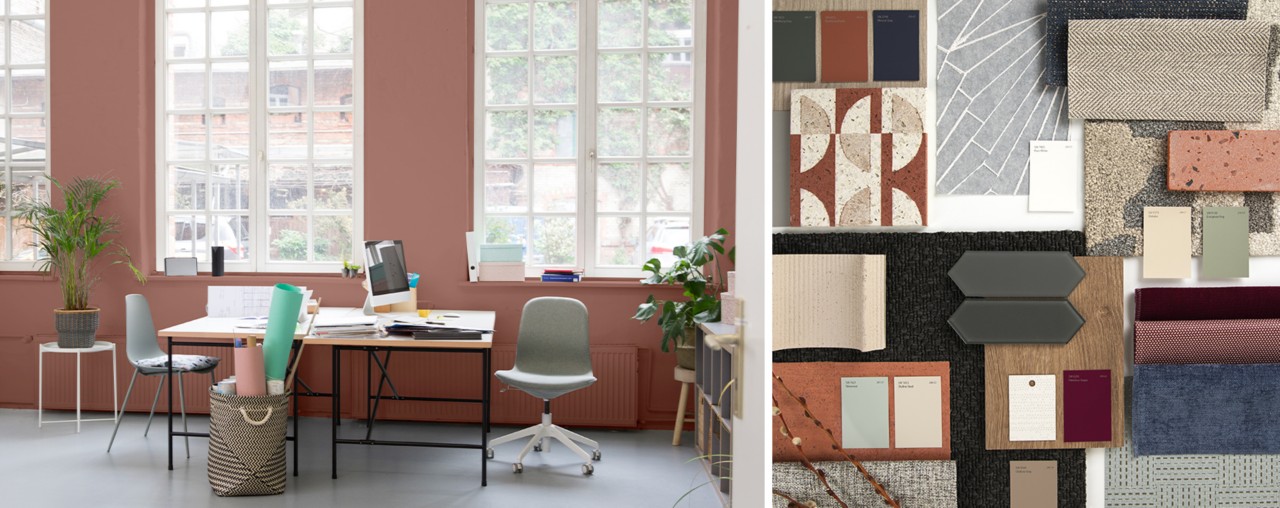 An office space with large windows. A variety of colorful color panels, fabric, cloths and rugs.