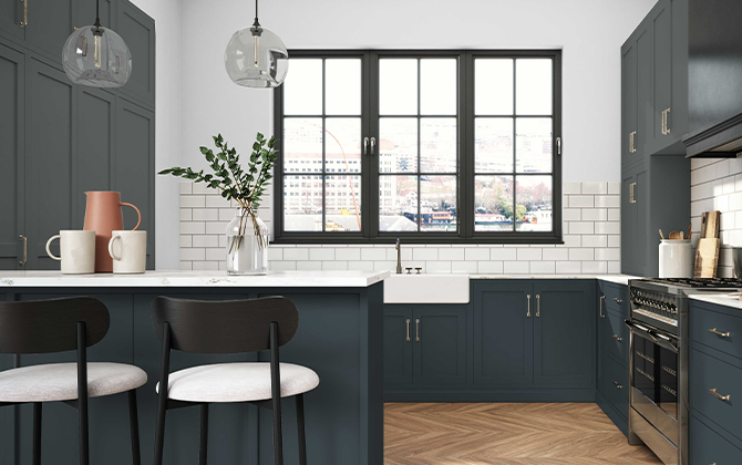 A kitchen with white tile backsplash, large window, and barstools. 