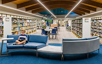 Four Point Design Partners renovated the Indianapolis Public Library Wayne Branch children’s area in Westhighland White SW 7566 (255-C3), Mindful Gray SW 7016 (244-C2), Manitou Blue SW 6501 (174-C5), Indigo SW 6531 (178-C7), and Cilantro SW 6453 (158-C6). Photo by Michael Firsich.