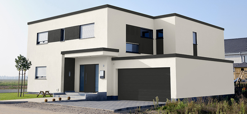 A modern home with white exterior in SW 7008 Alabaster. The garage, roof and window shades are in SW 7069 Iron Ore.