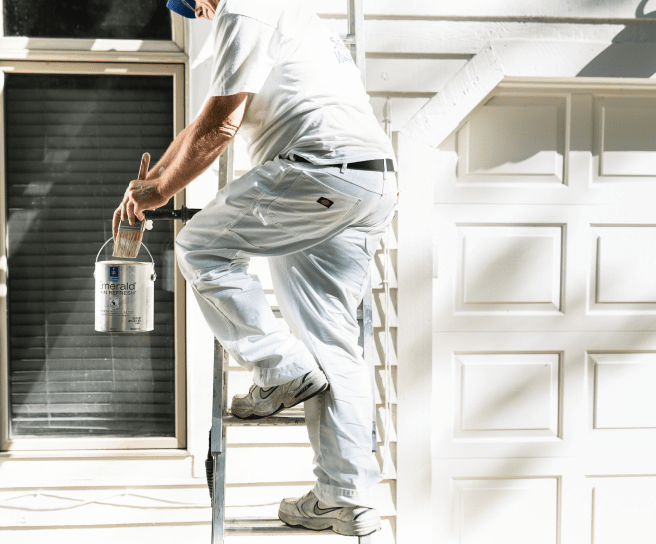 A painter on a ladder.