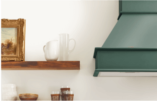 A wood shelf with a picture and vase on top of it.