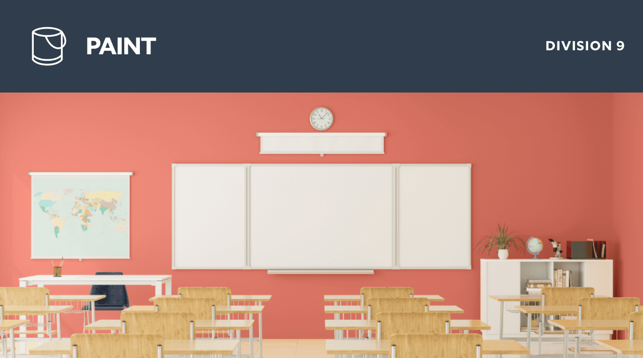 Paint. Division 9. A classroom with wooden desks facing a smart board on a coral painted wall.
