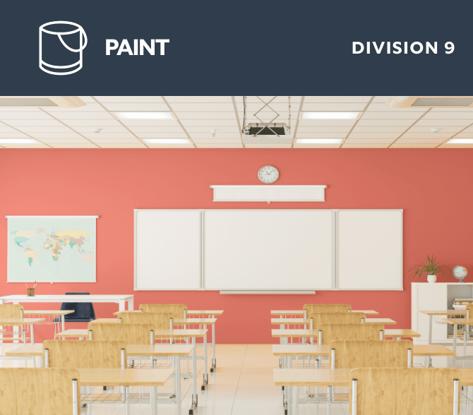 Paint. Division 9. A classroom with wooden desks facing a smart board on a coral painted wall.