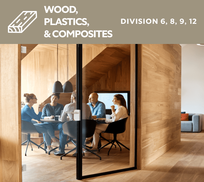 Wood, plastics, and composites. Division 6, 8, 9, 12. A group of people siting in a wood paneled meeting room.