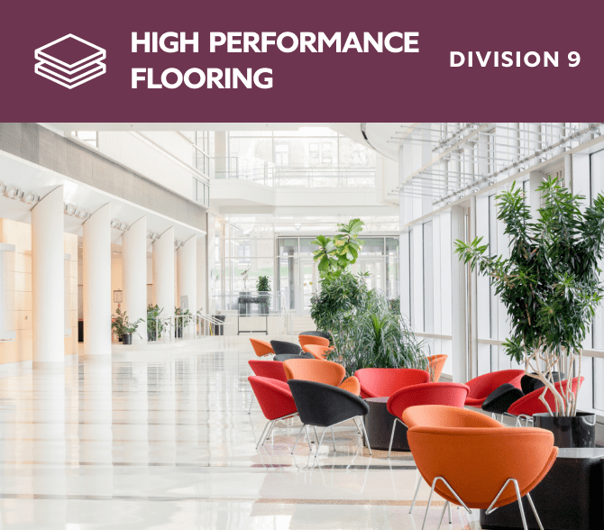 High performance flooring. Division 9. An atrium with bright colored chairs and potted trees.