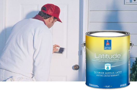 A paint pro applying Latitude Exterior Acrylic Latex paint to an exterior door.