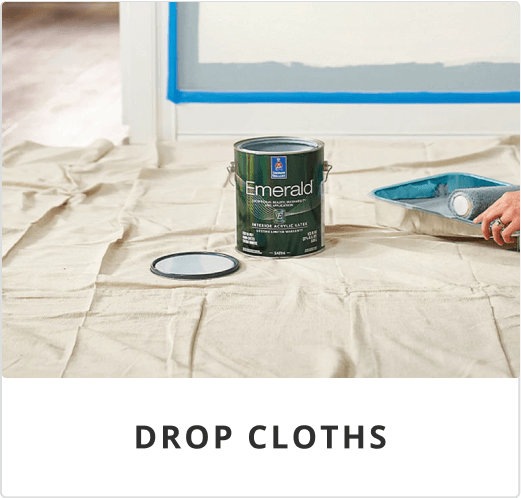 An open can of Sherwin-Williams Emerald interior paint sits on top of a drop cloth.