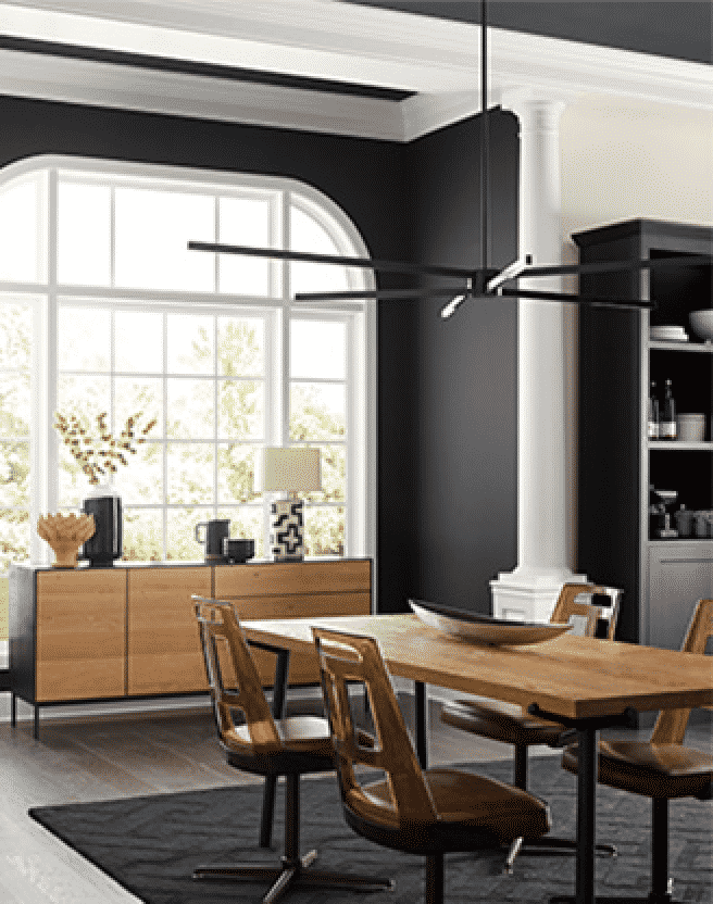 Dining room with large window, wooden furniture and black/white walls.