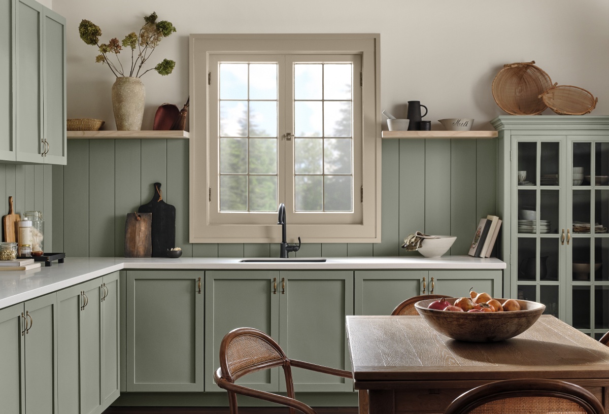 A farmhouse kitchen with 2022 Color of the Year, Evergreen Fog cabinets