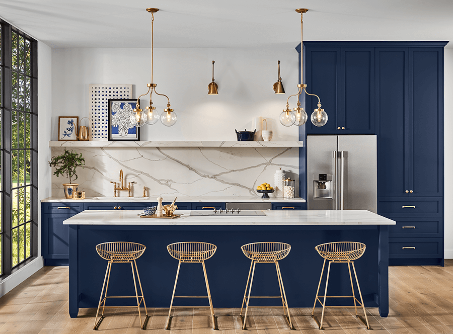 An open kitchen with navy island and cabinets, white walls and open shelves